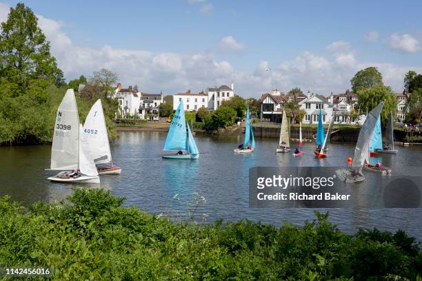 Local club members from the Twickenham Yacht Club gather at the start of a short boating competition on the River Thames near Ham, on 5th May 2019,...