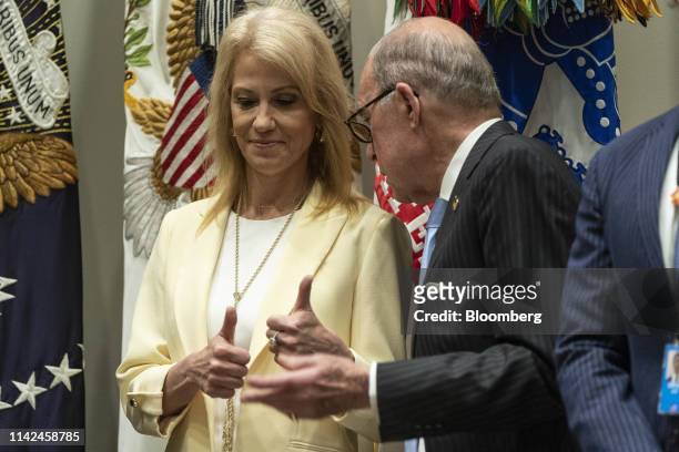Kellyanne Conway, senior advisor to U.S. President Donald Trump, left, gives thumbs up while speaking with Larry Kudlow, director of the U.S....