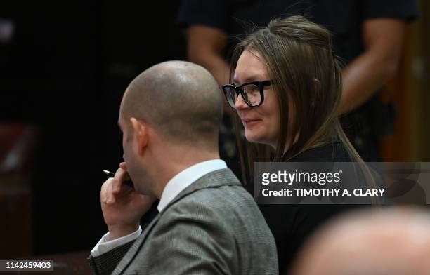 Fake German heiress Anna Sorokin sits next to her attorney Todd Spodek during her sentencing at Manhattan Supreme Court May 9, 2019 following her...