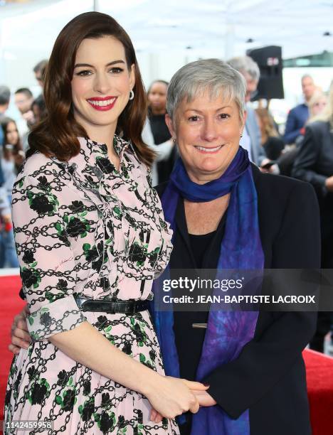 Actress Anne Hathaway and her mom Kate McCauley Hathaway stand on Hathaway's newly unveilled Star on the Hollywood Walk Of Fame in front of the...