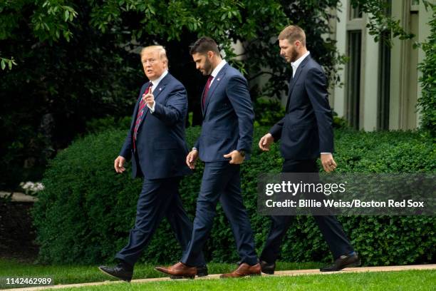 President Donald Trump walks with J.D. Martinez and Chris Sale of the Boston Red Sox during a visit to the White House in recognition of the 2018...