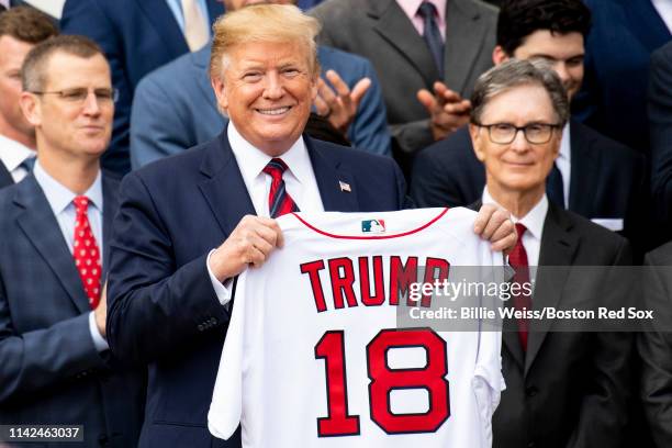 President Donald Trump is presented with a Boston Red Sox jersey during a visit to the White House in recognition of the 2018 World Series...