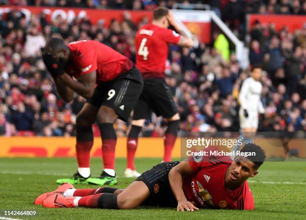 Phil Jones of Manchester United, Romelu Lukaku of Manchester United and Marcus Rashford of Manchester United react during the Premier League match...