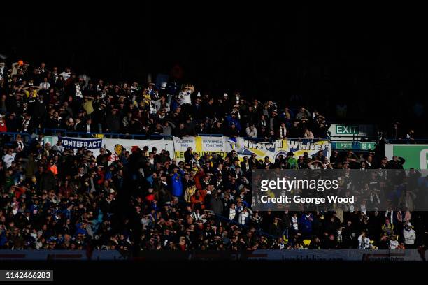 Fans of Leeds United shield their eyes from the sun during the Sky Bet Championship match between Leeds United and Sheffield Wednesday at Elland Road...