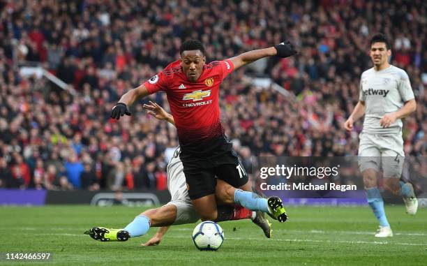 Anthony Martial of Manchester United is fouled by Ryan Fredericks of West Ham United for a penalty during the Premier League match between Manchester...