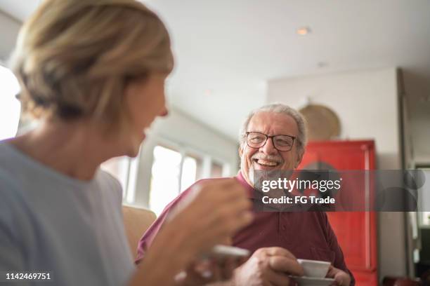 senior couple drinking coffee - senior man drinking tea stock pictures, royalty-free photos & images