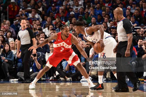 Kawhi Leonard of the Toronto Raptors defends Jimmy Butler of the Philadelphia 76ers during Game Six of the Eastern Conference Semifinals of the 2019...