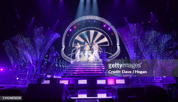 Take That perform on stage at the FlyDSA Arena on April 12, 2019 in Sheffield, England.