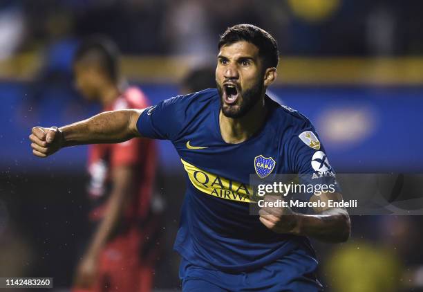 Lisandro Lopez of Boca Juniors celebrates after scoring the equalizer during a group G match between Boca Juniors and Atletico Paranaense as part of...