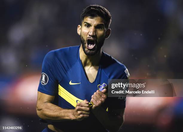 Lisandro Lopez of Boca Juniors celebrates after scoring the equalizer during a group G match between Boca Juniors and Atletico Paranaense as part of...