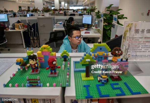 Worker in Huawei's Cyber Security Lab works on his computer at the company's production campus on April 25, 2019 in Dongguan, near Shenzhen, China....