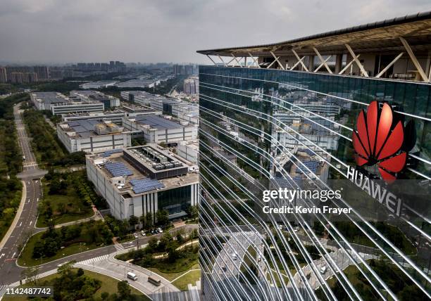The Huawei logo is seen on the side of the main building at the company's production campus on April 25, 2019 in Dongguan, near Shenzhen, China....