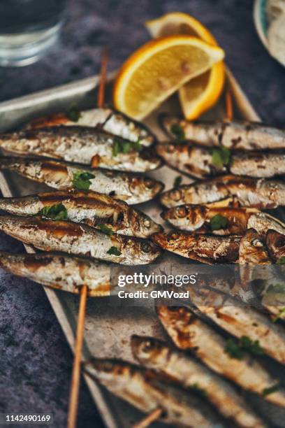 smelt fish on stick with fresh lemon - cook battered fish stock pictures, royalty-free photos & images