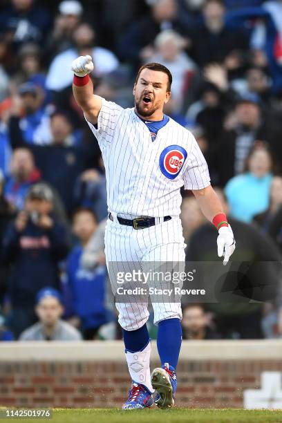 Kyle Schwarber of the Chicago Cubs reacts after being called out by the third base umpire during the ninth inning of a game against the Los Angeles...