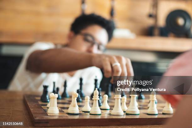 playing chess - kids playing chess stock pictures, royalty-free photos & images