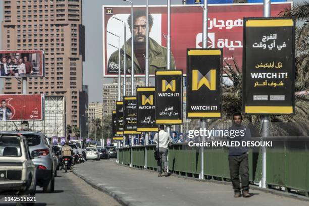 Picture taken on May 7, 2019 shows billboards advertising "Watch iT", Egypt's first video-streaming app, in the capital Cairo. - The video-streaming...