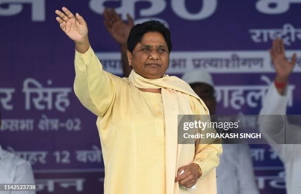 Bahujan Samaj Party president Mayawati waves to the crowd during a rally in New Delhi on May 10, 2019.