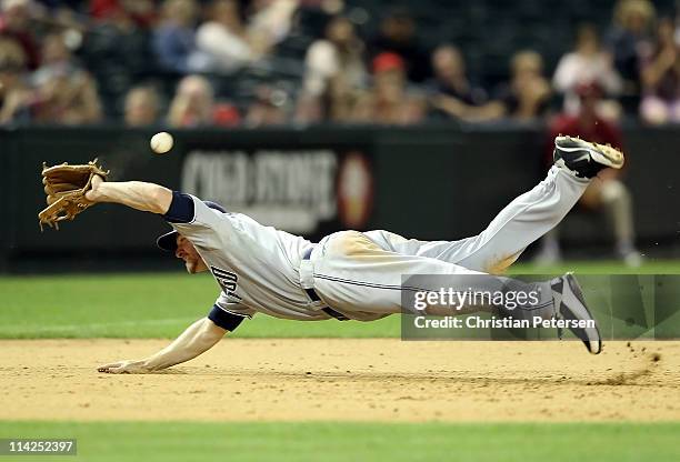 Infielder Chase Headley of the San Diego Padres dives as he attempts to field a single hit by the Arizona Diamondbacks during the Major League...