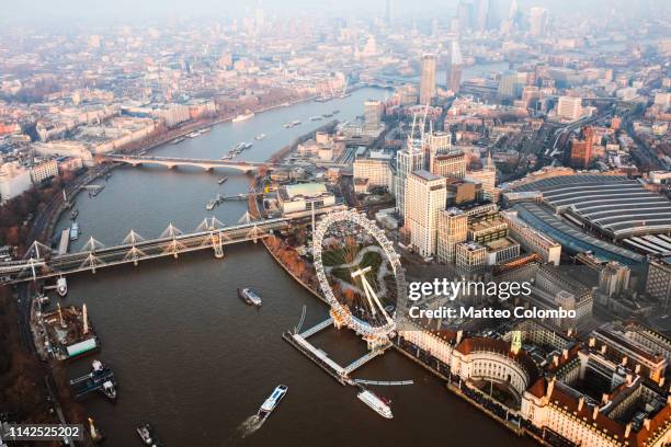 aerial view of the millenium wheel at sunset, london - millennium wheel stock pictures, royalty-free photos & images