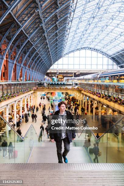 teenager walking at st pancras train station, london, uk - saint pancras railway station bildbanksfoton och bilder