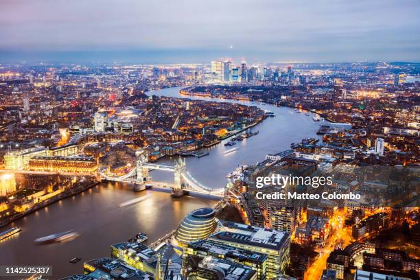 the tower bridge and river thames at dusk, london, uk - london night stock pictures, royalty-free photos & images