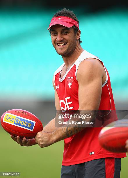 Daniel Bradshaw of the Swans handballs during a Sydney Swans AFL training session at Sydney Cricket Ground on May 17, 2011 in Sydney, Australia.