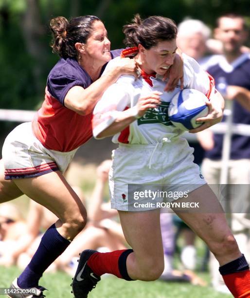 England Stormers NIcky Crawford gets a high tackle from USA Eagles Laura Cabrera on the opening day of the E-Kong Women's Rugby Seven's tournament...