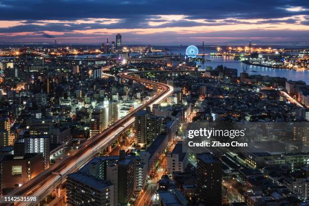 skyline of osaka bay at dusk - osaka skyline stock pictures, royalty-free photos & images