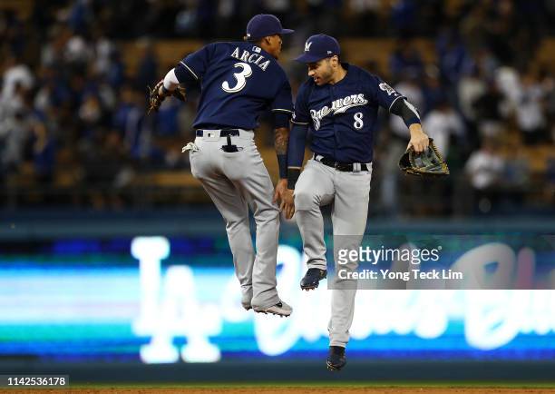 Orlando Arcia and Ryan Braun of the Milwaukee Brewers celebrate their 4-1 victory against the Los Angeles Dodgers at Dodger Stadium on April 13, 2019...