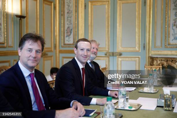 And co-founder of Facebook Mark Zuckerberg poses next to Facebook head of global policy communications and former UK deputy prime minister Nick Clegg...