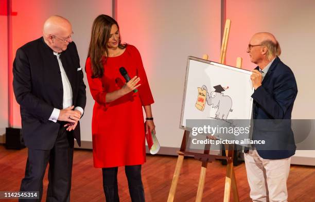 Dieter Lenzen , President of the University of Hamburg, is given a drawing by Otto Waalkes, a comedian, on the occasion of the celebration of the...