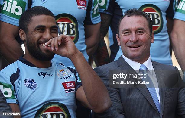 Michael Jennings and coach Ricky Stuart share a joke during the New South Wales Blues State of Origin team photo session at Crowne Plaza Coogee on...