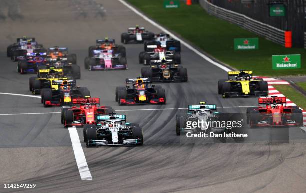 Lewis Hamilton of Great Britain driving the Mercedes AMG Petronas F1 Team Mercedes W10 leads the field at the start during the F1 Grand Prix of China...