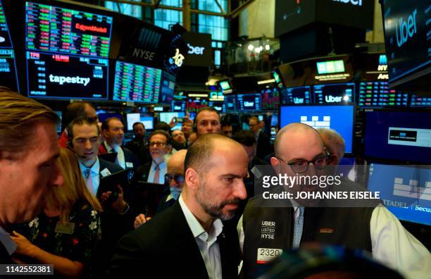 Uber CEO, Dara Khosrowshahi , talks to traders after the opening bell during his ride sharing company's IPO, at the New York Stock Exchange , on May...