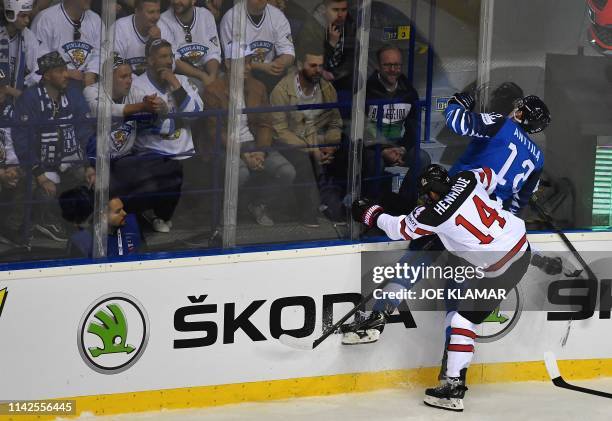 Finland's forward Marko Antilla and Canada's forward Adam Henrique vie during the IIHF Men's Ice Hockey World Championships Group A match between...