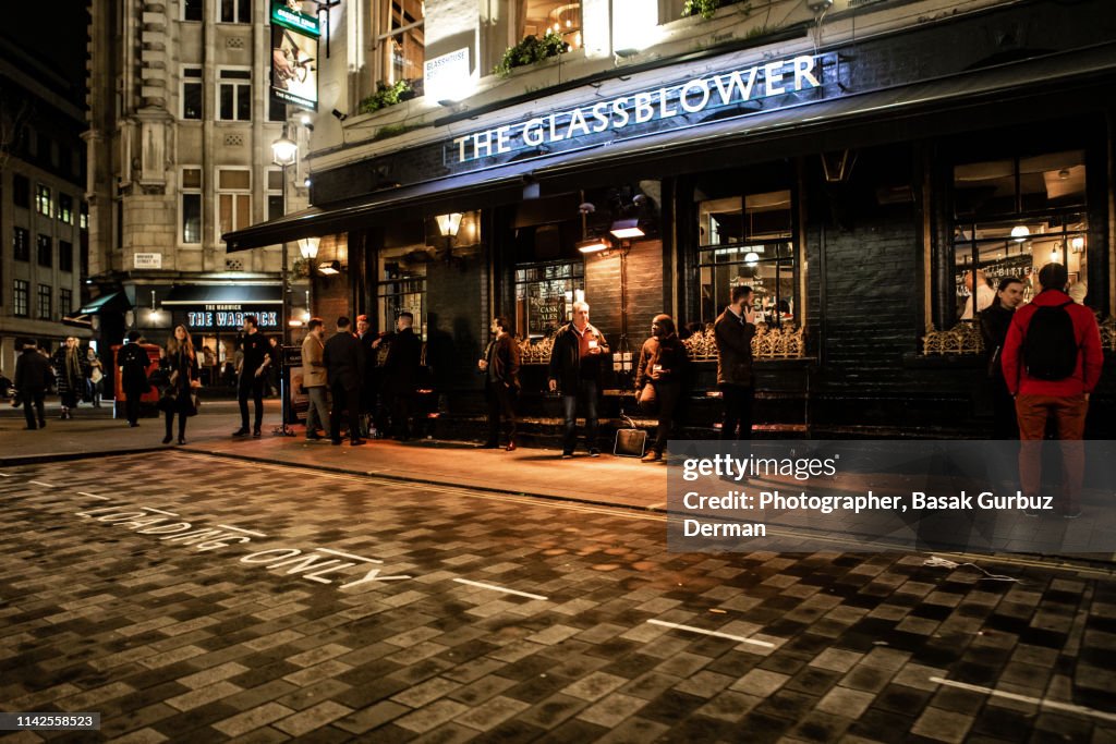 People drinking outside the Glassblower pub, Soho