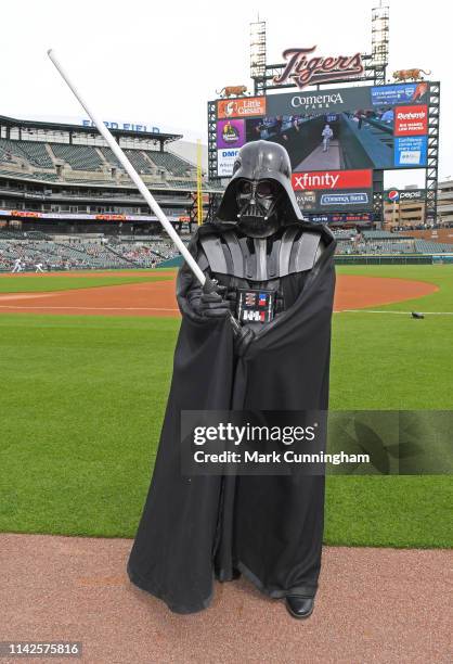 An actor dressed as Darth Vader poses for a photo prior to the Star Wars Night promotion game between the Detroit Tigers and the Kansas City Royals...