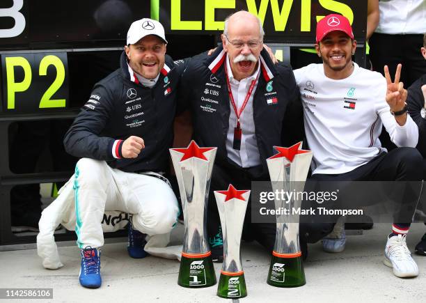 Race winner Lewis Hamilton of Great Britain and Mercedes GP, celebrates with second placed Valtteri Bottas of Finland and Mercedes GP and Head of...