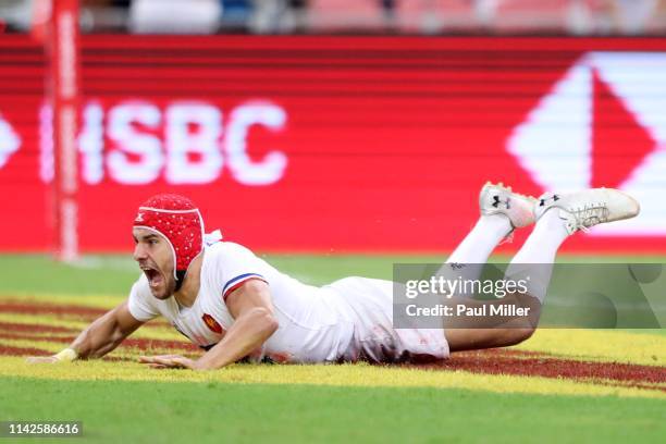 Gabin Villiere of France scores a try during the Challenge Trophy final between Scotland and France on day two of the HSBC Rugby Sevens Singapore at...