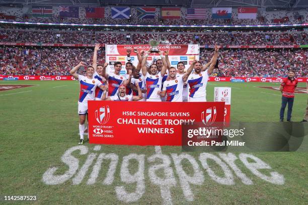 France players celebrate winning the Challenge Trophy on day two of the HSBC Rugby Sevens Singapore at the National Stadium on April 14, 2019 in...