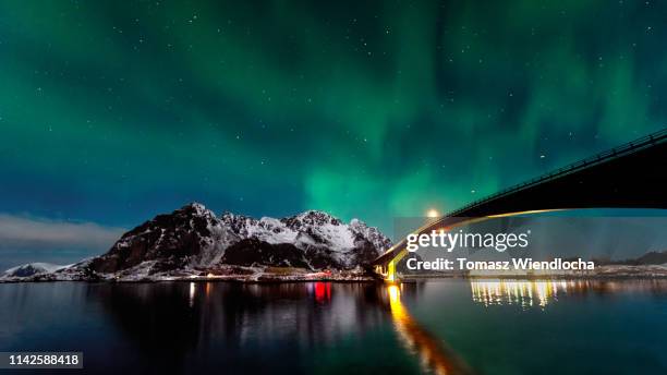 aurora over a bridge mountains and sea - ship's bridge foto e immagini stock