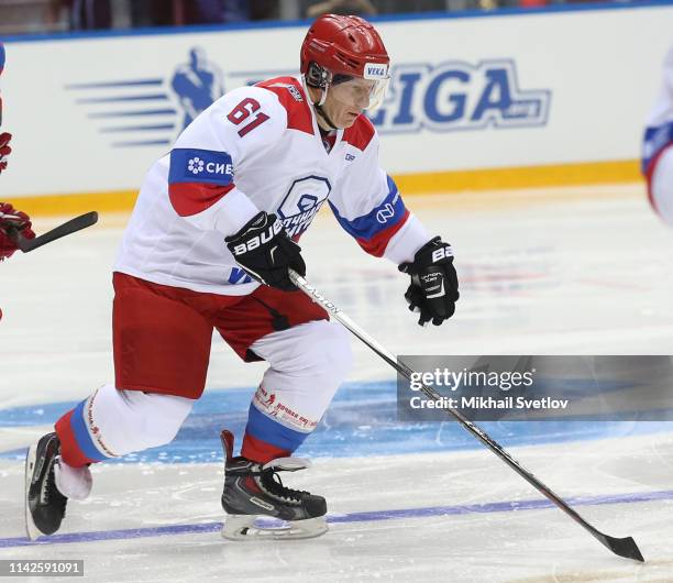 Russian billionaire and businessman Vladimir Potanin controls a puck during the gala match of the Night Hockey League at Bolshoi Ice Dome on May 10,...