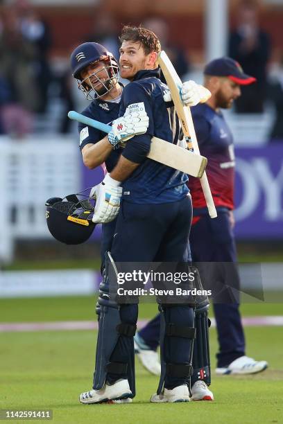 James Harris of Middlesex celebrates reaching his century with John Simpson during the Royal London One Day Cup Quarter Final match between Middlesex...