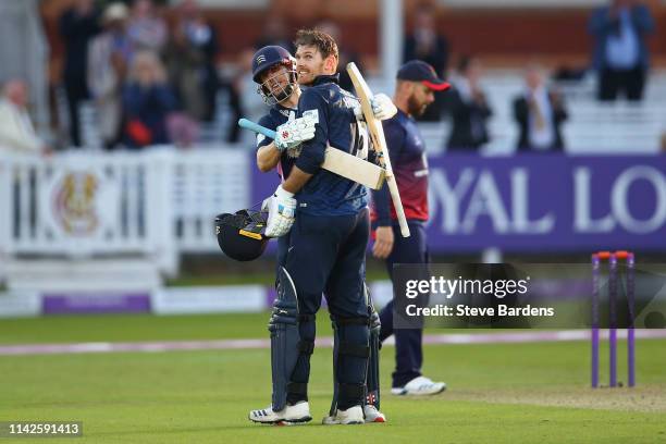 James Harris of Middlesex celebrates reaching his century with John Simpson during the Royal London One Day Cup Quarter Final match between Middlesex...