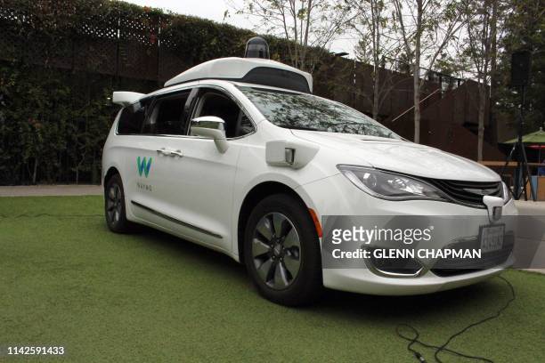 Waymo self-driving car pulls into a parking lot at the Google-owned company's headquarters in Mountain View, California, on May 8, 2019.