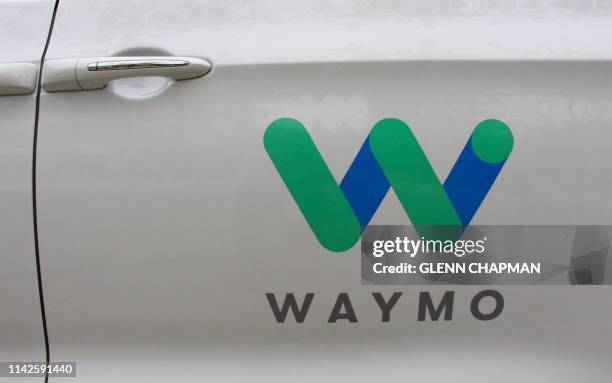 Waymo self-driving cars with the company logo at the Google-owned company's headquarters in Mountain View, California, on May 8, 2019.