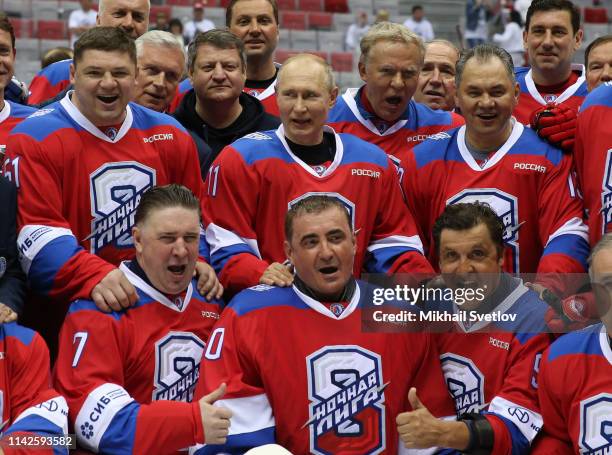 Russian President Vladimir Putin poses for a photo during the gala match of the Night Hockey League at Bolshoi Ice Dome on May 10, 2019 in Sochi,...