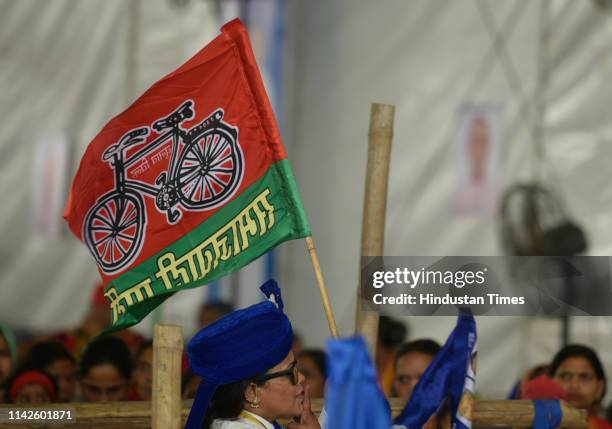 Bahujan Samaj Party supporter holds a party flag during BSP chief Mayawati's public meeting, at Ramlila Maidan, on May 10, 2019 in New Delhi, India.
