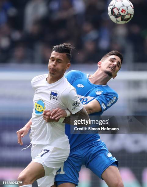 Benjamin Hübner of Hoffenheim is challenged by Davie Selke of Berlin during the Bundesliga match between TSG 1899 Hoffenheim and Hertha BSC at...