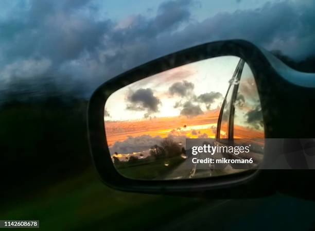 view of a car wing mirror. sunset time - car side view mirror stock pictures, royalty-free photos & images